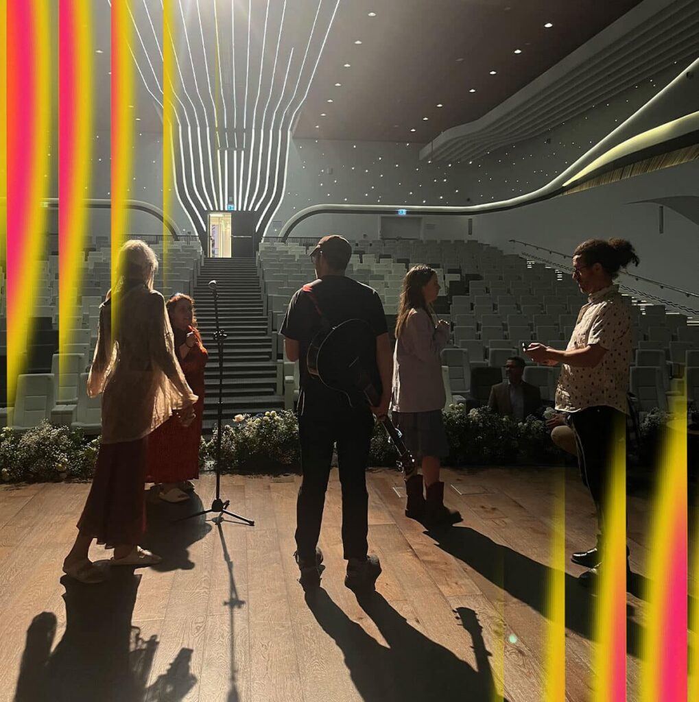 BIMM University Music and Film students on stage as participants of the 'We Are The Possible' project at COP28.