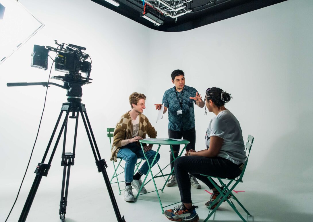 Filmmaking and Director talking to students during shoot