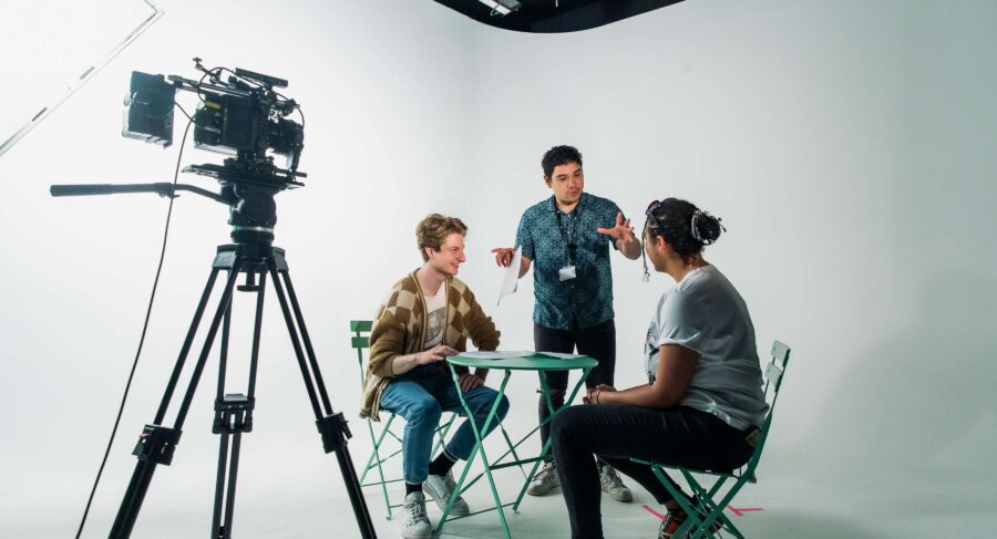 Filmmaking and Director talking to students during shoot