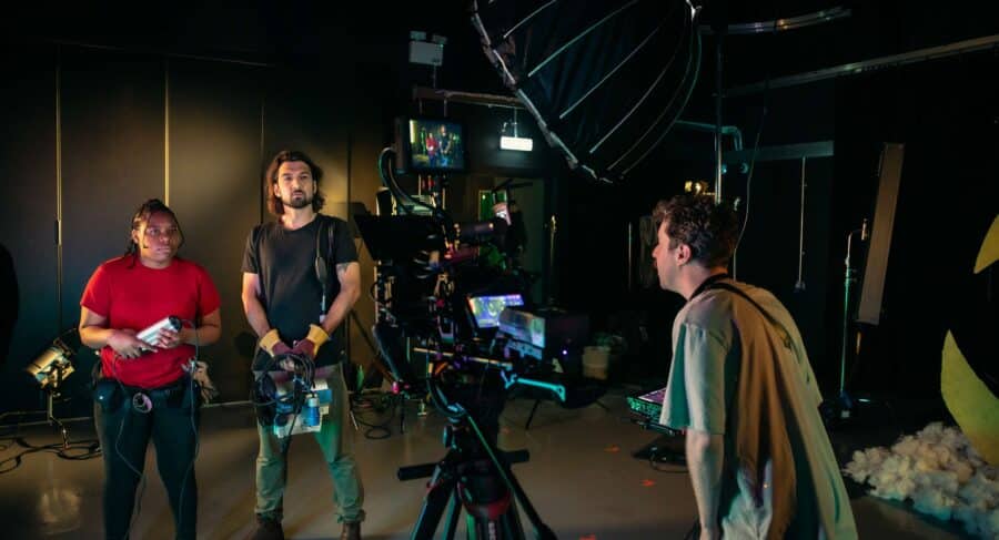 Three student using Camera Production at a set