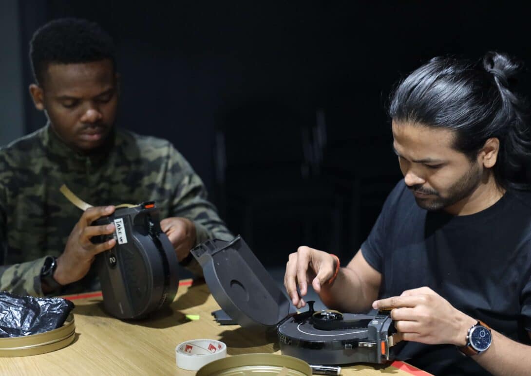 MetFilm School students disassembling film camera
